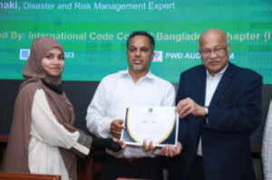 A candidate receiving the Certificate of Recognition from Dr. S. K. Ghosh and Dr. Abdul Latif Helaly